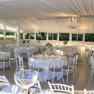 Marquee Party Tent With Tables Chairs and Other Decorations for Outdoor Wedding Event