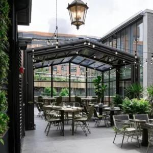 Retractable Aluminum Alloy Glass Sliding Sunroom System for Restaurants and Outdoor Dining Areas with Motorized Roof